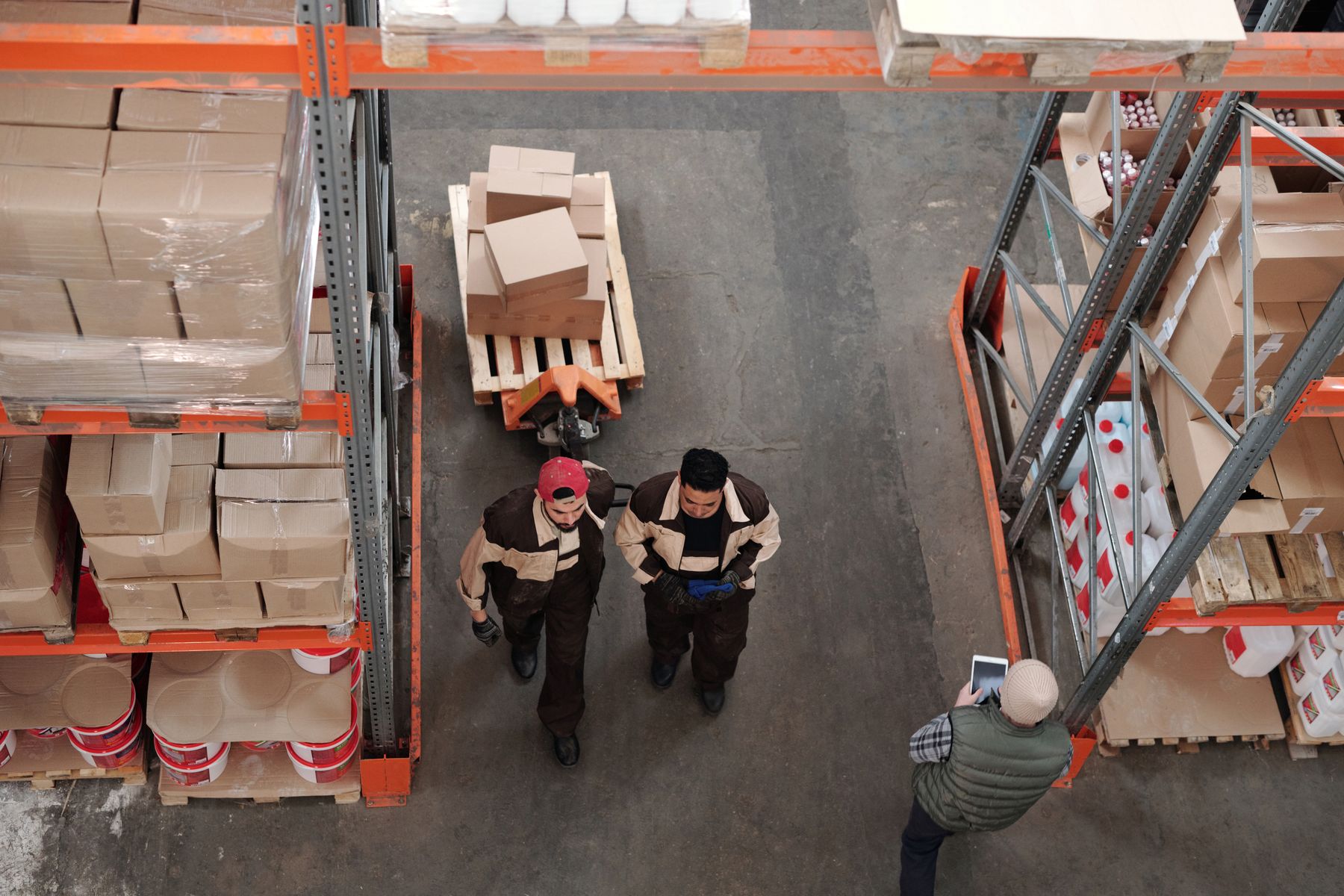 Warehouse workers preparing parcels and pallets