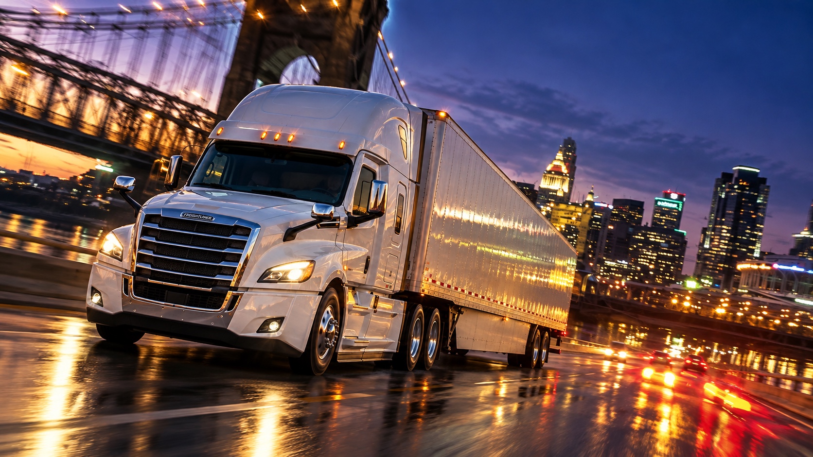 White freight truck driving through a lit city at dusk